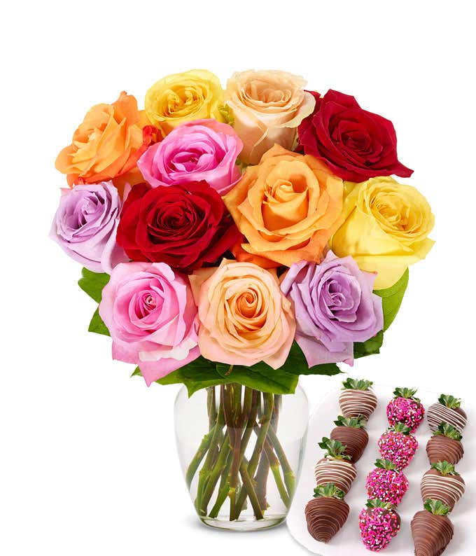 One dozen rainbow roses with one dozen chocolate covered strawberries decorated with pink sprinkles.