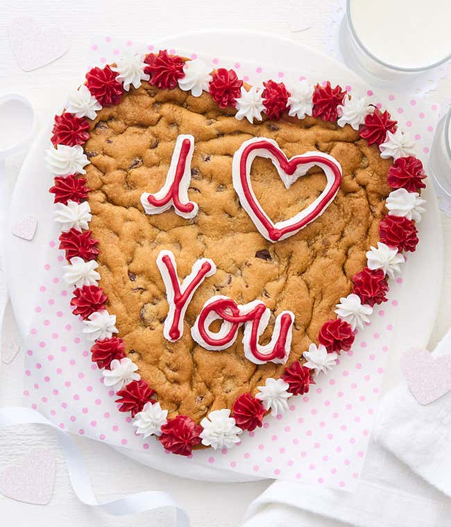 A 9&quot; chocolate chip cookie heart with &quot;I Love You&quot; Written in frosting 
